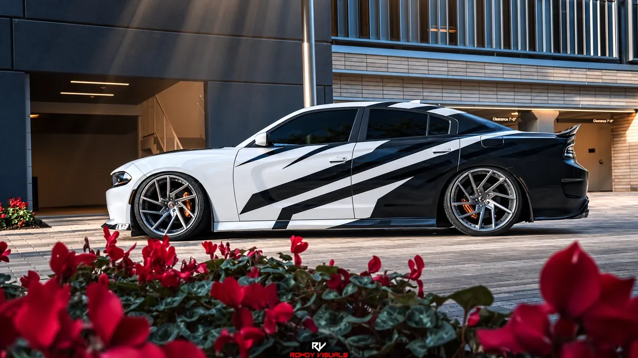 White Dodge Charger with black slash graphics along its side