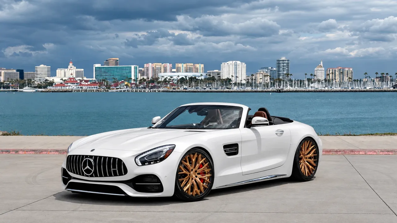 White Mercedes-AMG GT convertible on gold mesh wheels