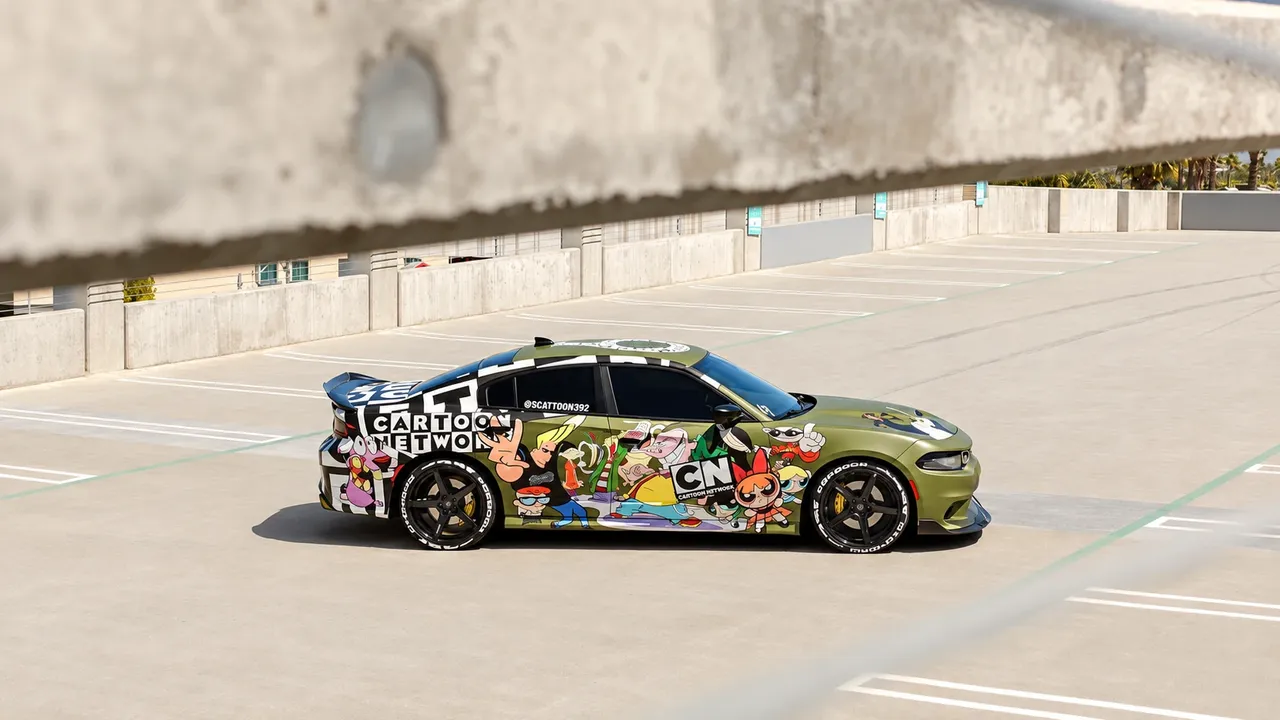 Dodge Charger with a cartoon-print wrap on black wheels