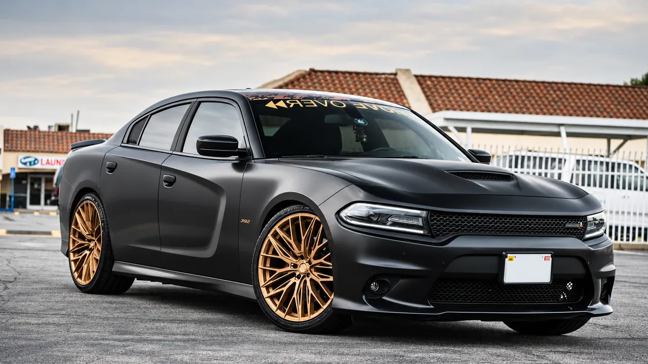 Matte black Dodge Charger on gold mesh wheels